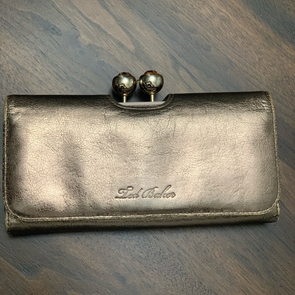 Ted Baker- snap wallet metallic bronze. Mauve TB initials and inside.